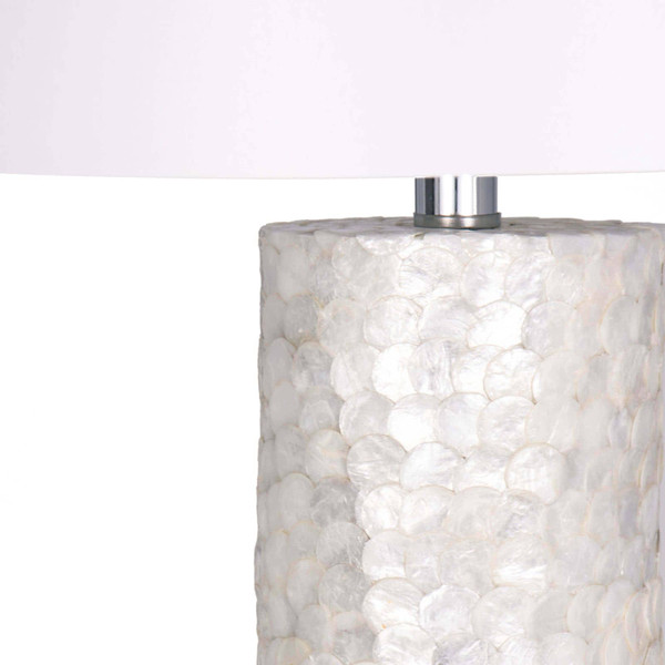 Capiz lamp with shiny scalloped shells and white linen shade